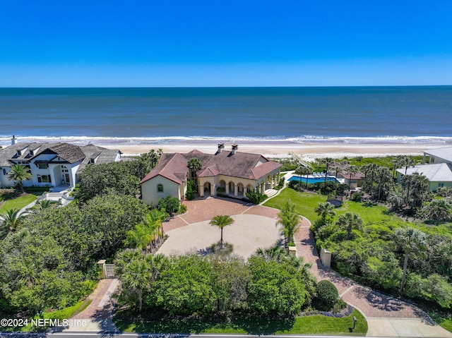 bird's eye view with a water view and a beach view