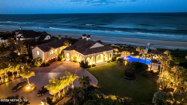 aerial view featuring a view of the beach and a water view