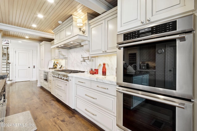 kitchen with white cabinetry, appliances with stainless steel finishes, wooden ceiling, and dark hardwood / wood-style flooring