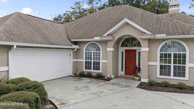 ranch-style house featuring a garage