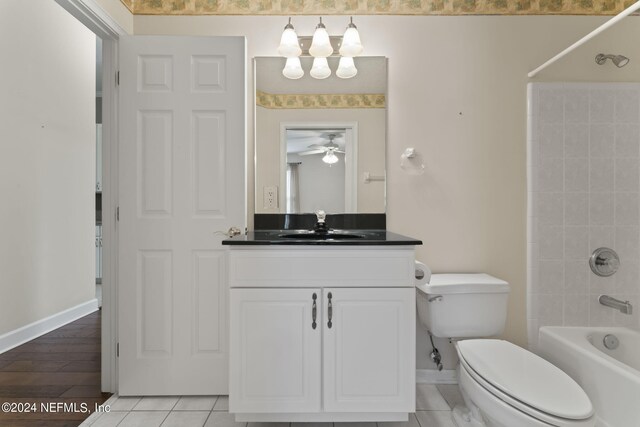 full bathroom with ceiling fan, vanity, toilet, bathing tub / shower combination, and hardwood / wood-style floors