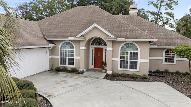 ranch-style house featuring a garage