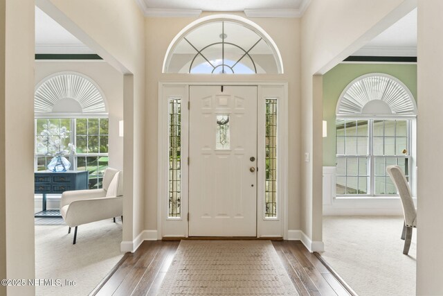 4039 Glenhurst Dr N, Jacksonville, FL 32224 - entrance foyer featuring wood-type flooring, plenty of natural light, and crown molding