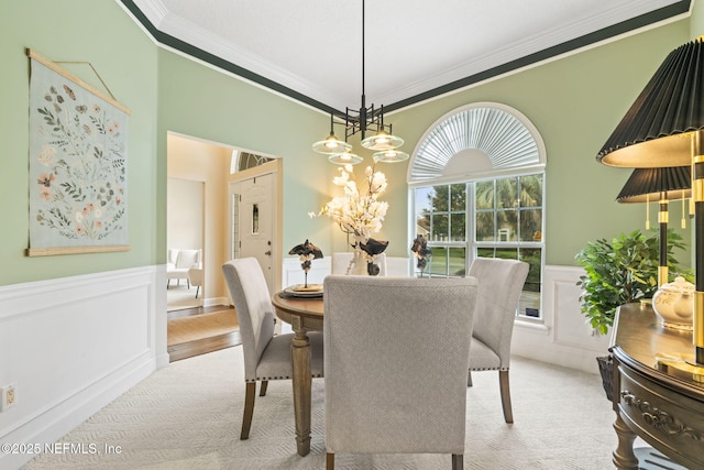 4039 Glenhurst Dr N, Jacksonville, FL 32224 - dining area with ornamental molding, a wainscoted wall, carpet flooring, a chandelier, and a decorative wall