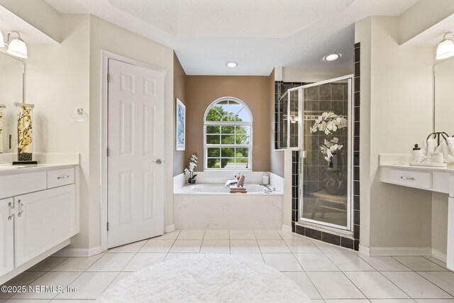 4039 Glenhurst Dr N, Jacksonville, FL 32224 - bathroom with a shower stall, vanity, a garden tub, tile patterned floors, and baseboards