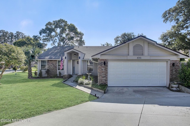 ranch-style home featuring concrete driveway, brick siding, and a front lawn