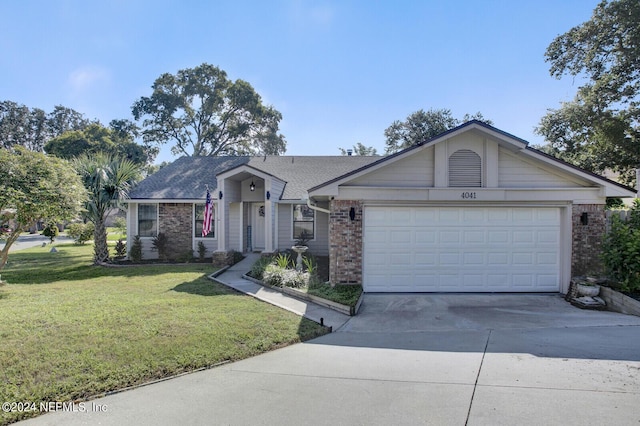 ranch-style home with a garage, a front yard, concrete driveway, and brick siding