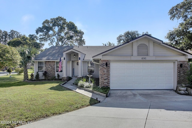 ranch-style home with concrete driveway, brick siding, an attached garage, and a front yard