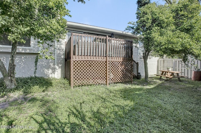 view of yard with fence and a wooden deck