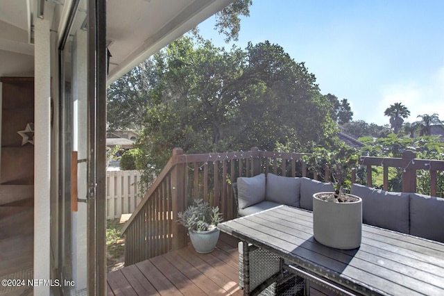 deck featuring outdoor lounge area