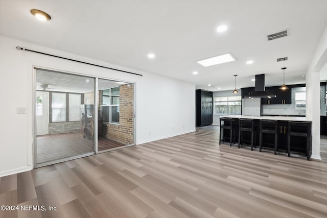 unfurnished living room featuring light hardwood / wood-style flooring