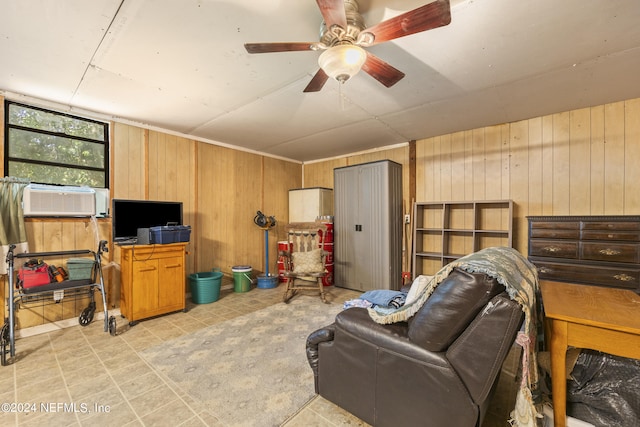 tiled living room with cooling unit, wooden walls, and ceiling fan