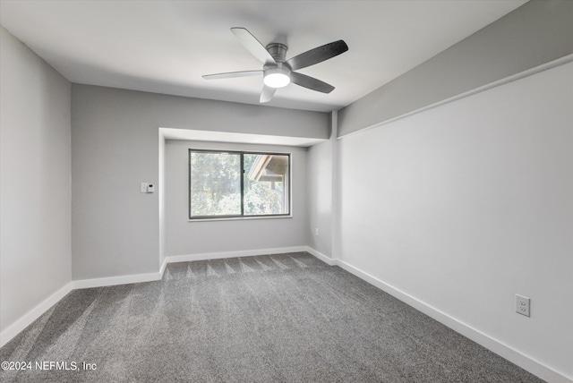 spare room with ceiling fan and carpet floors