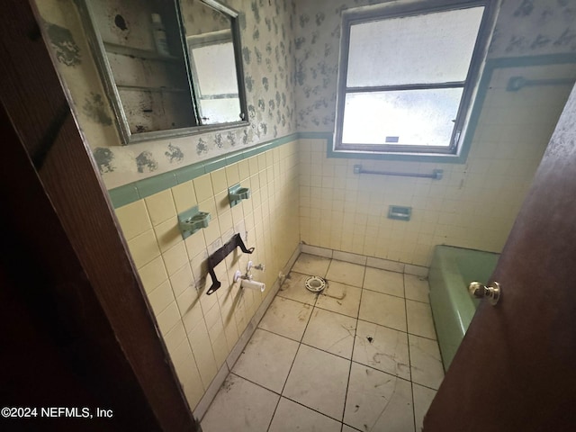 bathroom featuring tile walls, tile patterned floors, and plus walk in shower