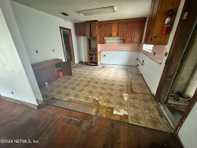 kitchen with hardwood / wood-style flooring