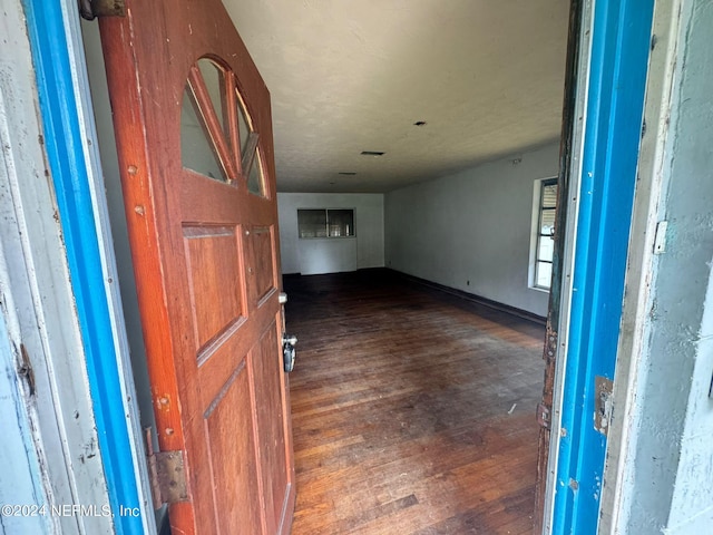 entryway with dark hardwood / wood-style floors