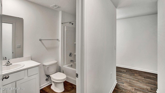 bathroom with shower / bath combination, visible vents, toilet, vanity, and wood finished floors