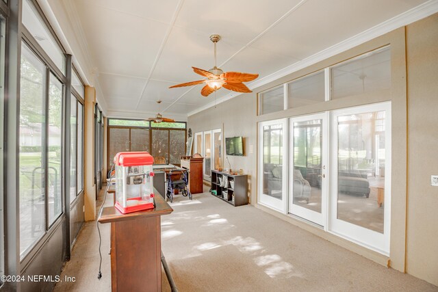 sunroom featuring ceiling fan