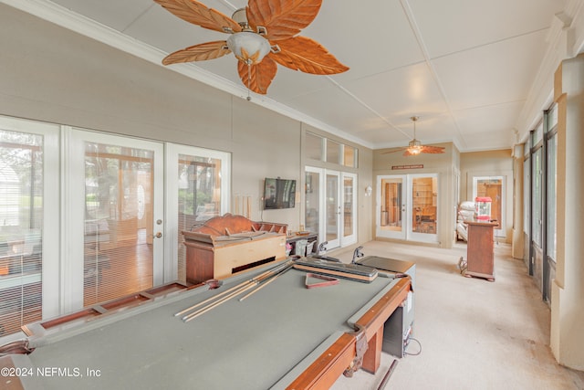 recreation room featuring crown molding, ceiling fan, pool table, light colored carpet, and french doors