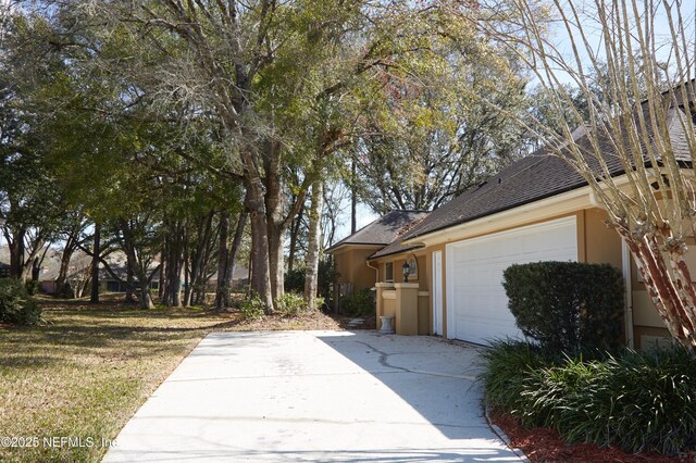 view of property exterior featuring a garage