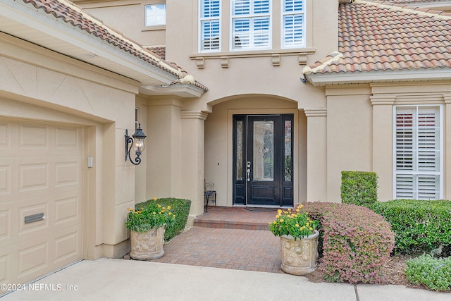 doorway to property featuring a garage