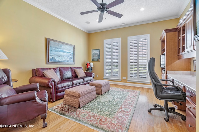 office with a textured ceiling, crown molding, ceiling fan, and light hardwood / wood-style floors