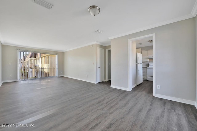 unfurnished living room with baseboards, ornamental molding, visible vents, and wood finished floors
