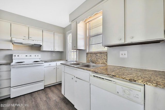 kitchen with white cabinets, white appliances, under cabinet range hood, a sink, and dark wood-style floors