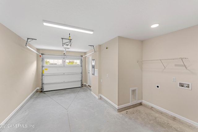 garage featuring a garage door opener and baseboards