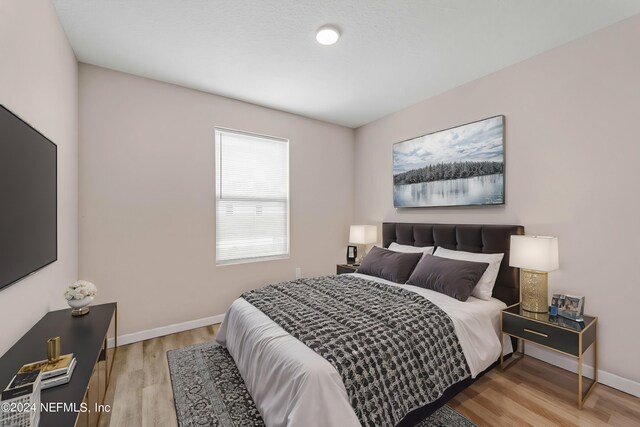 bedroom featuring light hardwood / wood-style floors