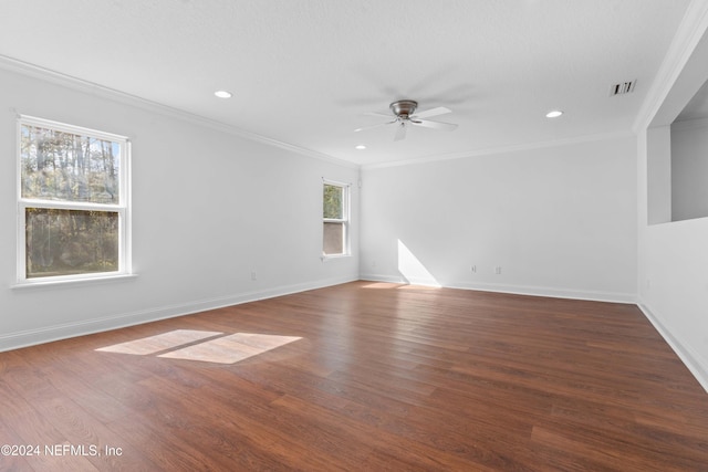 spare room featuring ornamental molding, dark hardwood / wood-style floors, and ceiling fan