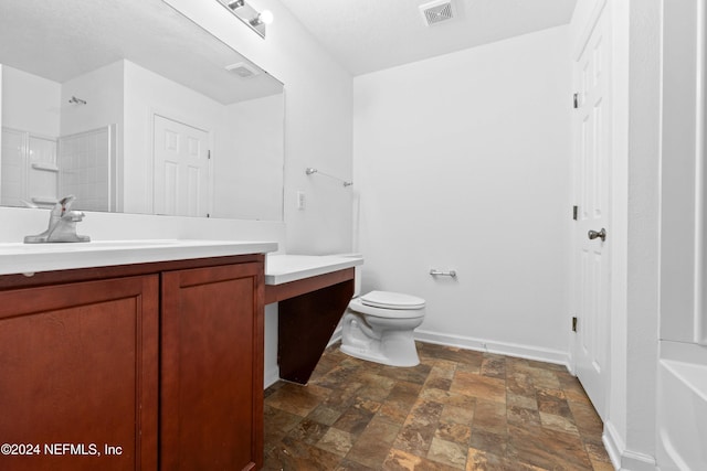 full bathroom featuring vanity, a textured ceiling, toilet, and washtub / shower combination