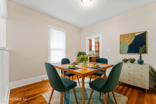 dining space featuring dark hardwood / wood-style flooring