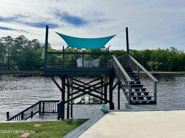 view of dock featuring stairway and a water view