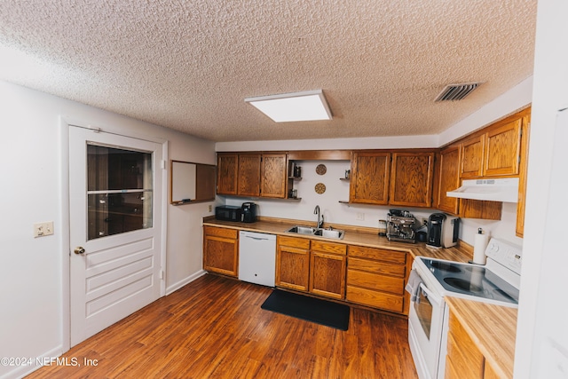 kitchen featuring white appliances, visible vents, under cabinet range hood, open shelves, and a sink