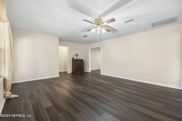 unfurnished living room with ceiling fan and dark hardwood / wood-style flooring