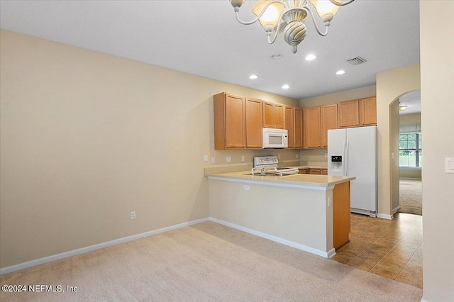 kitchen with white appliances, visible vents, arched walkways, light countertops, and light carpet