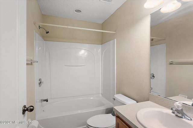 full bath with toilet, a textured ceiling, bathing tub / shower combination, vanity, and a textured wall