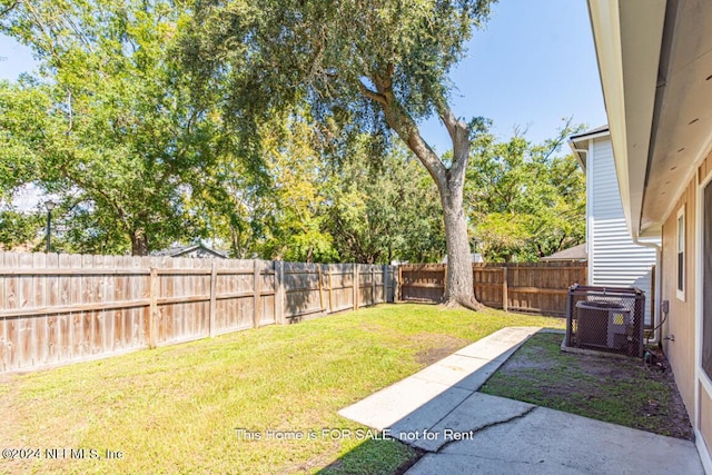 view of yard featuring central AC