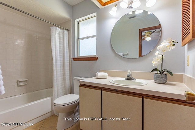 full bathroom with ceiling fan, tile patterned floors, shower / bath combination with curtain, toilet, and vanity