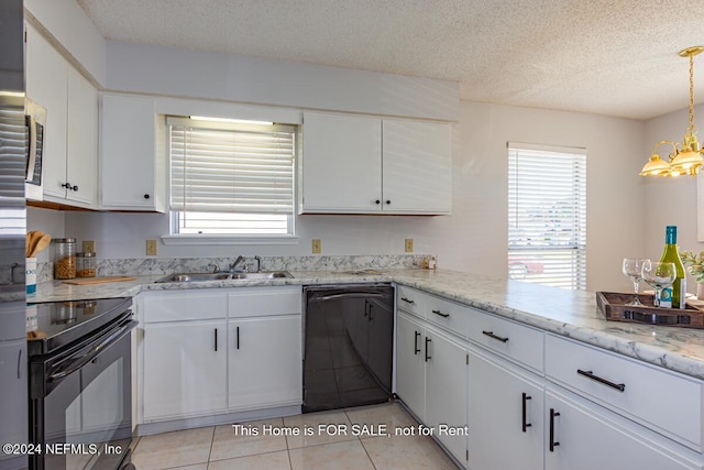 kitchen with white cabinets, a healthy amount of sunlight, and black appliances