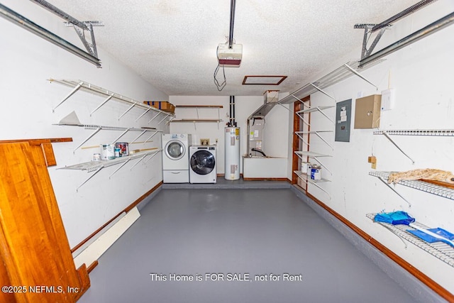 garage featuring a garage door opener, electric water heater, electric panel, and washer and clothes dryer