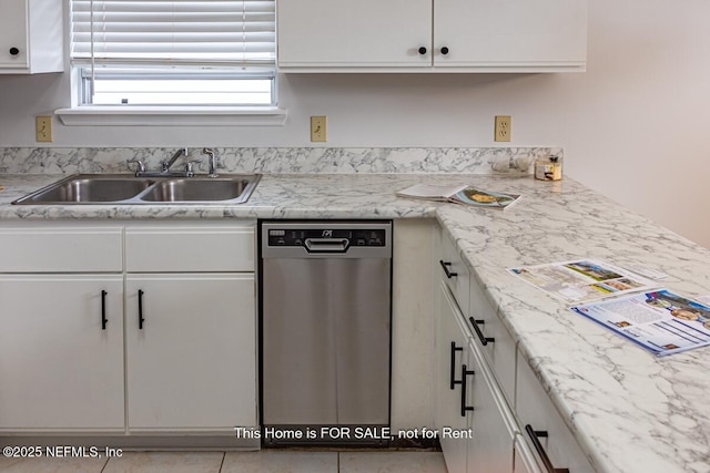 kitchen featuring white cabinetry, dishwasher, sink, and light stone counters