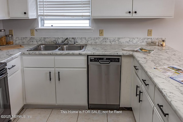 kitchen featuring sink, light tile patterned floors, dishwasher, white cabinetry, and range with electric cooktop