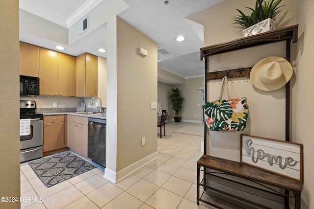 kitchen featuring ornamental molding, black appliances, light tile patterned floors, and sink