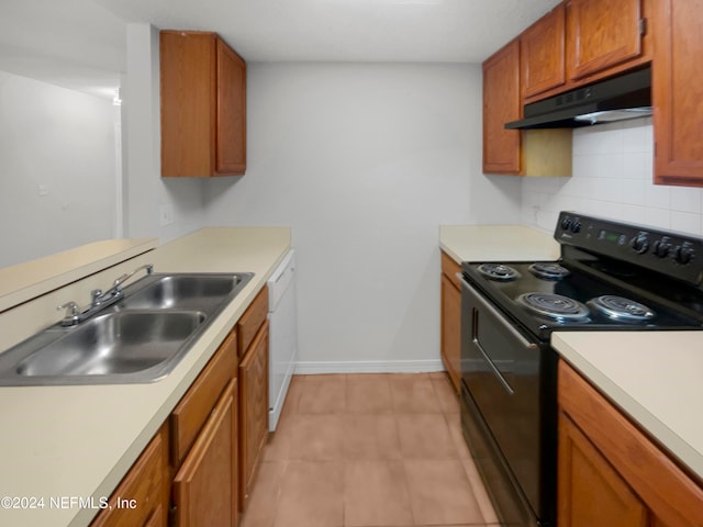 kitchen with backsplash, light tile patterned floors, white dishwasher, black range with electric stovetop, and sink