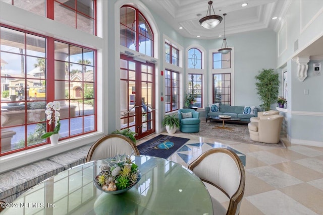 interior space with a wealth of natural light, beamed ceiling, coffered ceiling, and french doors