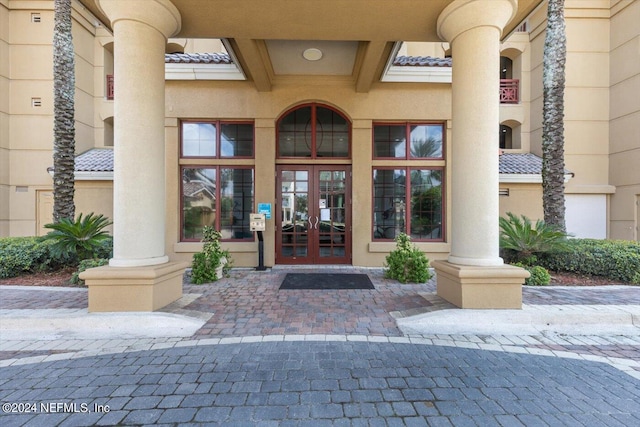 view of exterior entry featuring french doors