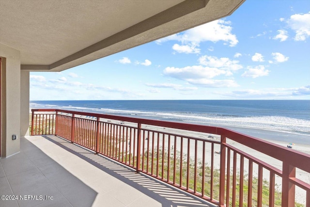 balcony with a view of the beach and a water view