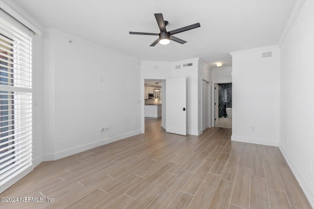 interior space featuring ornamental molding, ceiling fan, and light hardwood / wood-style flooring